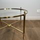 Neoclassical Round Coffee Table in Brass with Fluted Supports and Floral Motifs