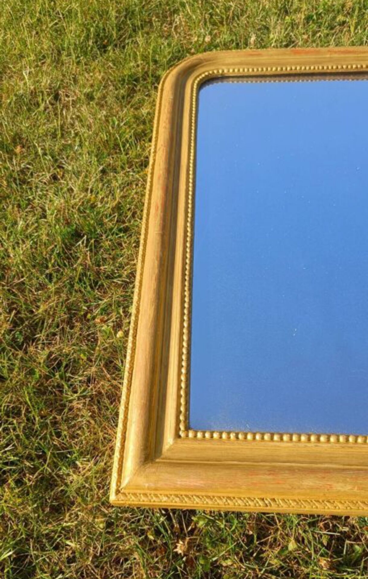 Antique Louis-Philippe mirror, gilded and patinated.