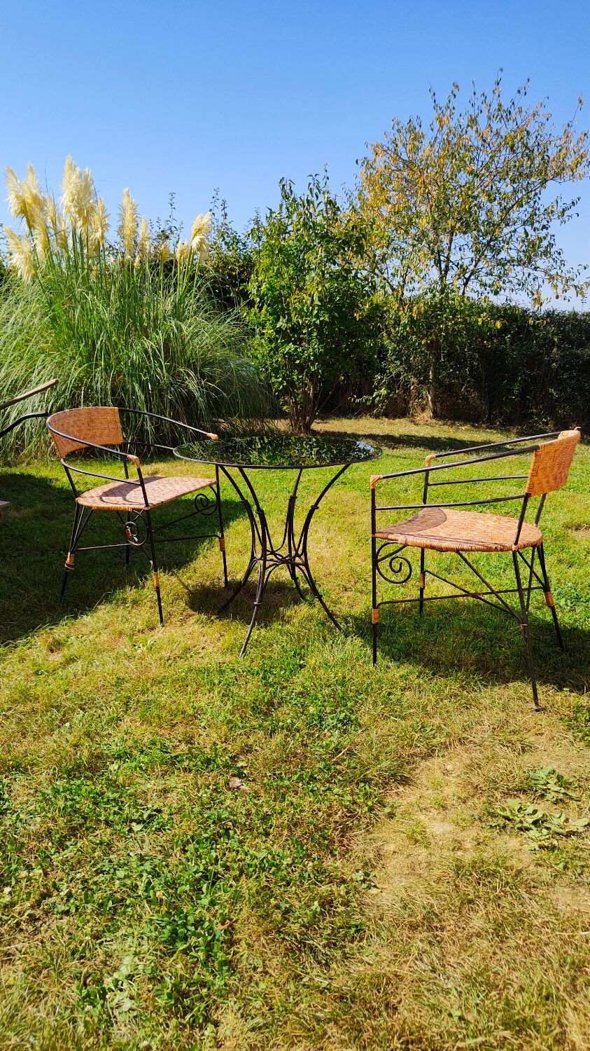 Garden table and wrought iron chair