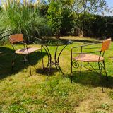 Garden table and wrought iron chair