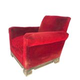 Red armchair with decorated base