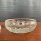 Set of three round thick moulded glass candle holders