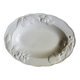 Oval white vegetable dish, an antique tableware piece in barbotine earthenware.