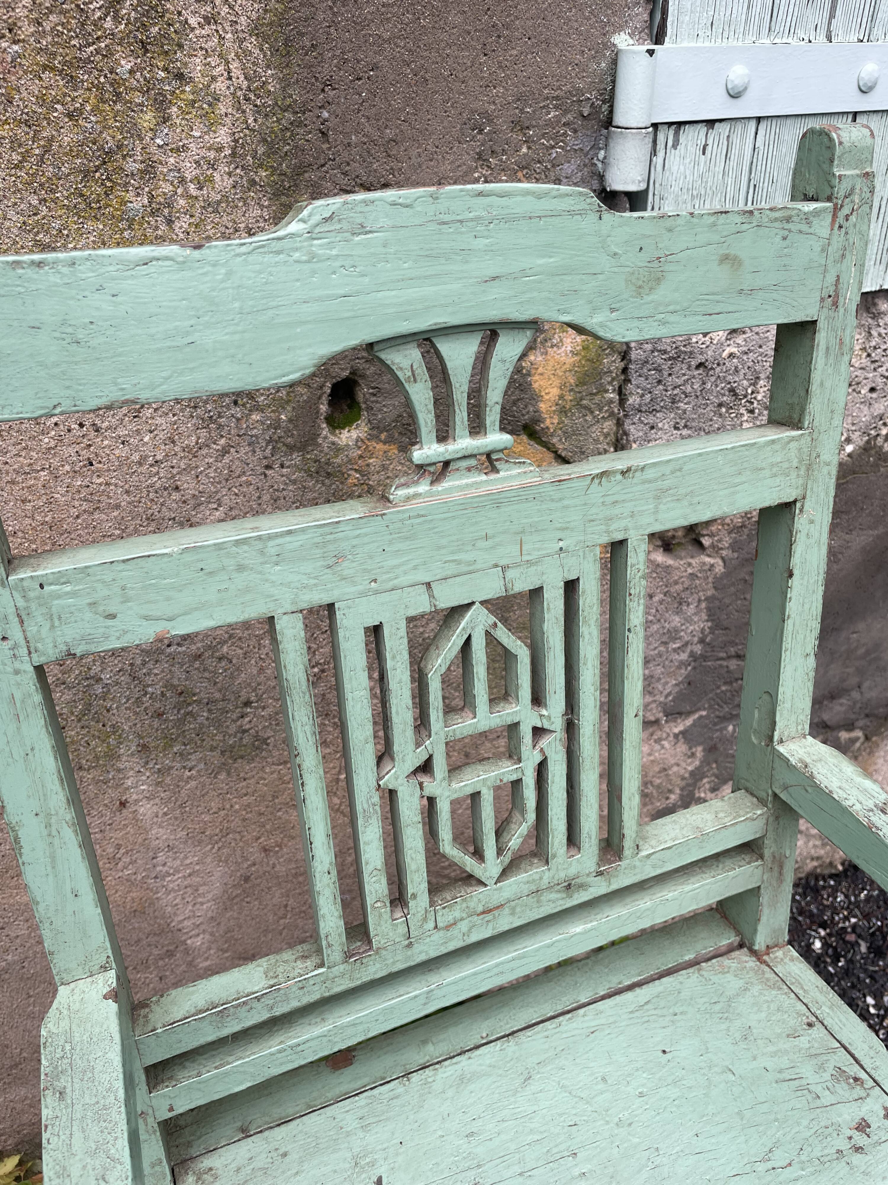 Indian chair in green lacquered wood