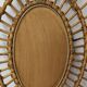 Oval rattan mirror, France circa 1960.