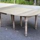 Round extendable dining table with flaps, stripped in raw oak, with 3 extensions.
