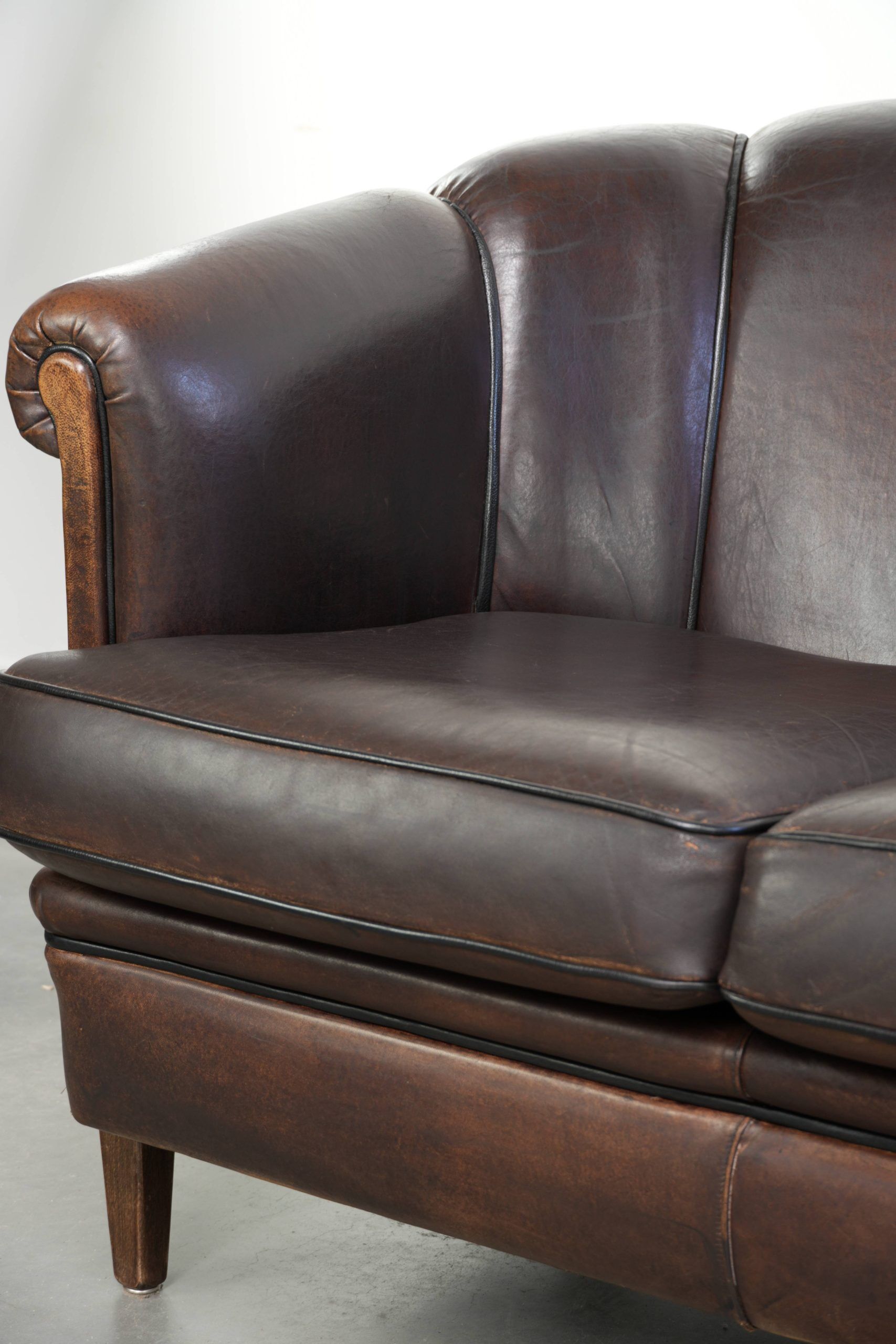 Unique sheepskin 3-seater sofa with deep colours and a distinctive design