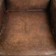 Comfortable sheepskin armchair with matching piping and a timeless look