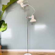 Chrome and white metal floor lamp, circa 1970.