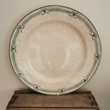 Large old round plate in iron earth