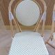 Pair of Parisian bistro chairs from Maison Louis Drucker in light Manila rattan.
