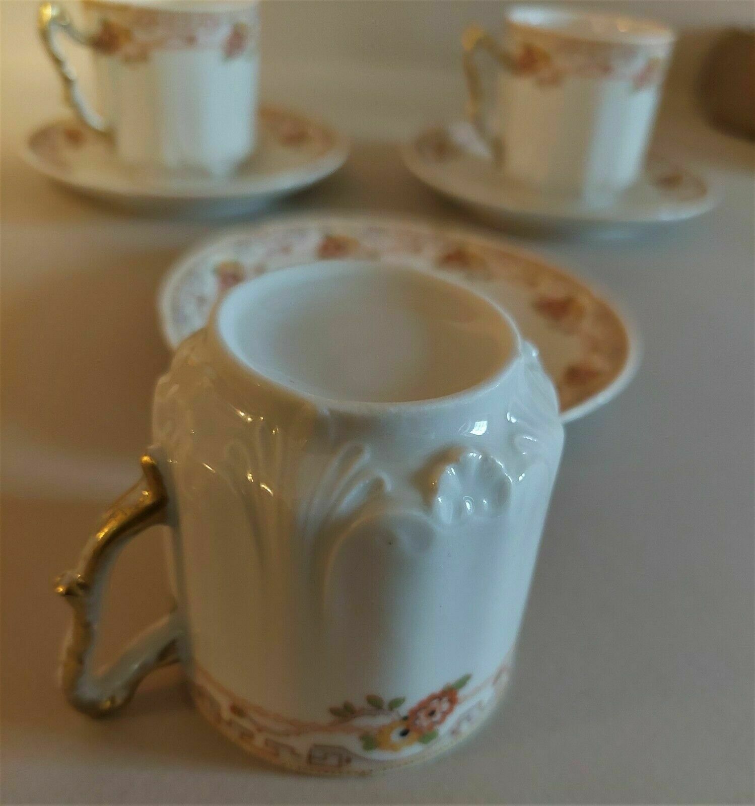 Porcelain cups UC Limoges, series of three