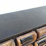 Black metal storage cabinet with 60 wooden drawers