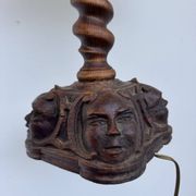 Sculpted wooden lamp with faces, antique.