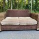 Exotic 2-seater sofa in woven banana tree / rattan and brown fabric.