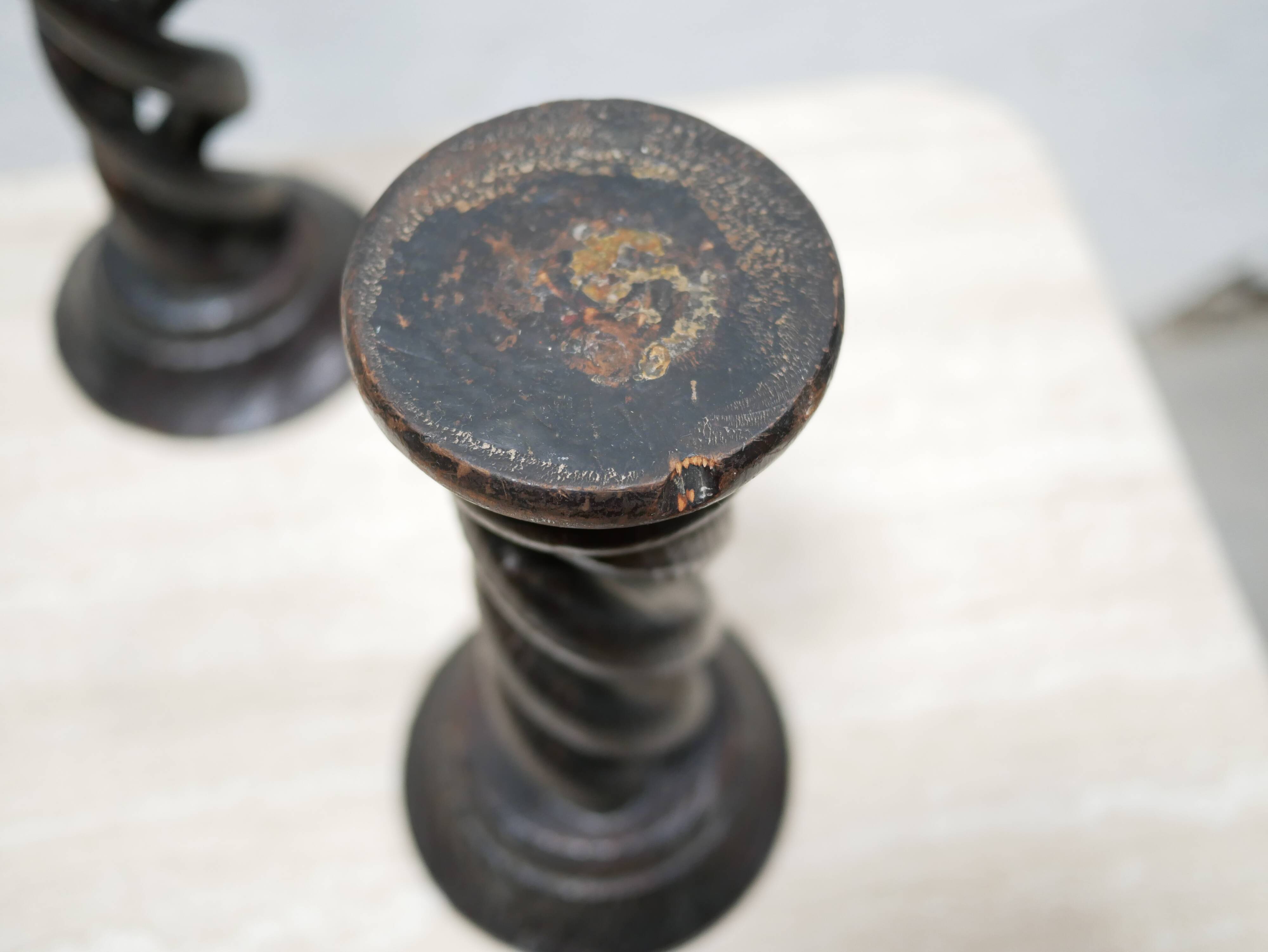 Pair of antique turned wooden candle holders