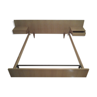 Bed with integrated bedside tables