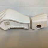 Duo of candle holder and empty pocket in the shape of a hand