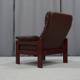 Pair of armchairs and ottoman in leather, 1970