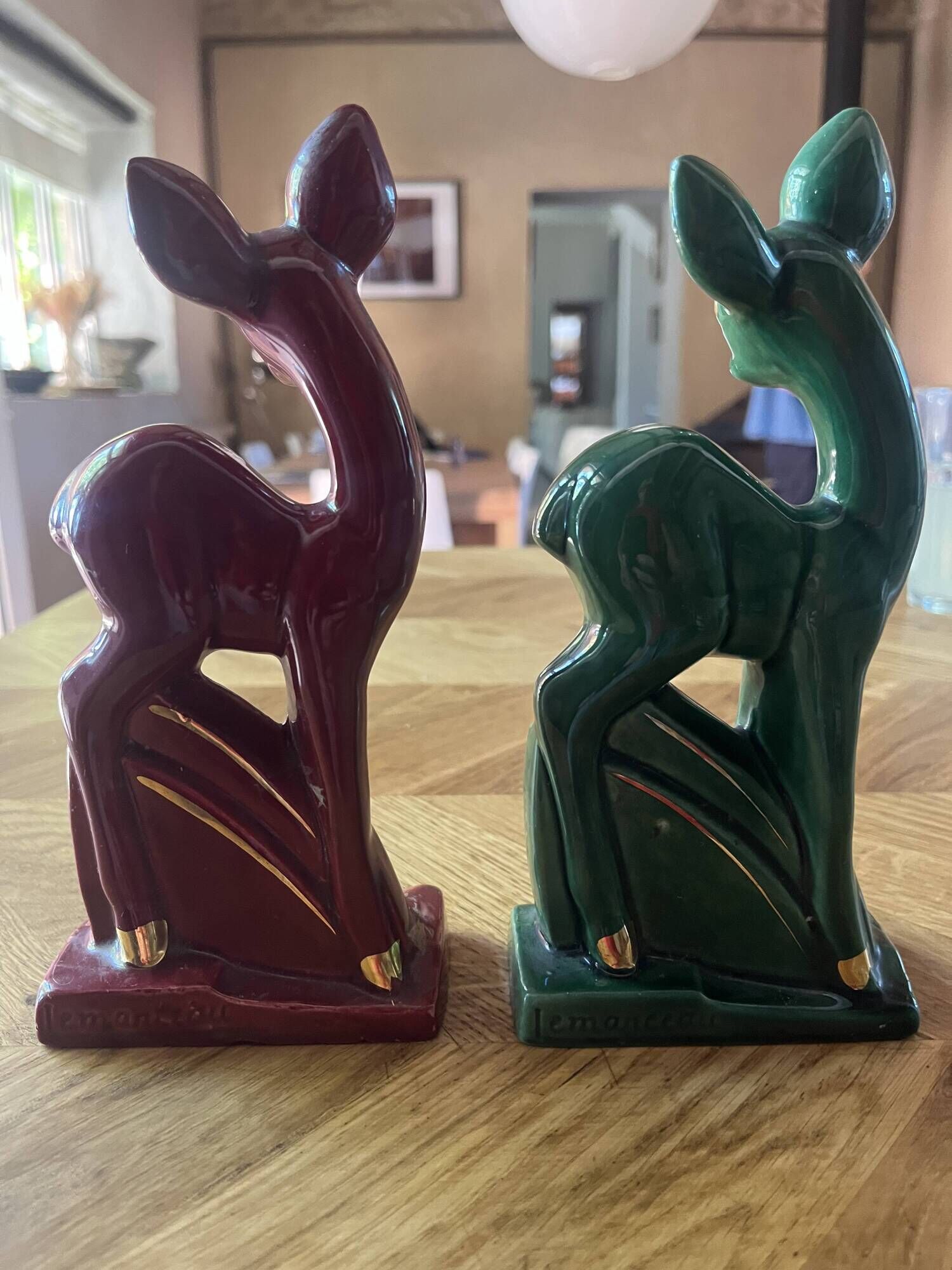 Pair of Art Deco deer by Charles Lemanceau in red and green ceramic.