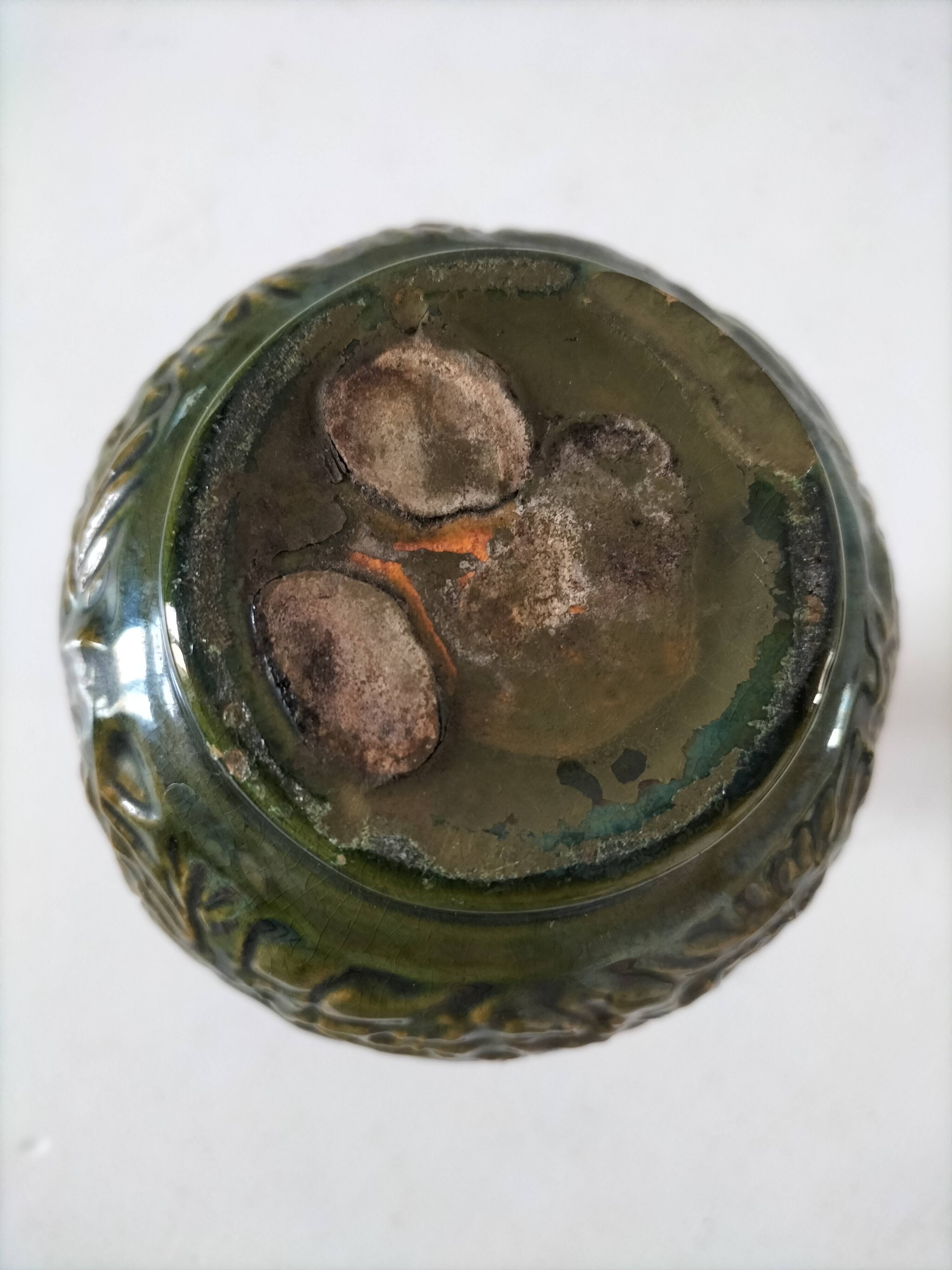 Small glazed vase with raised floral decoration