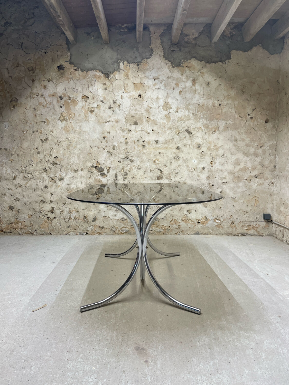 Smoked glass oval table from the 1970s.