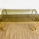 Gold metal and smoked glass coffee table – 1970s-624001