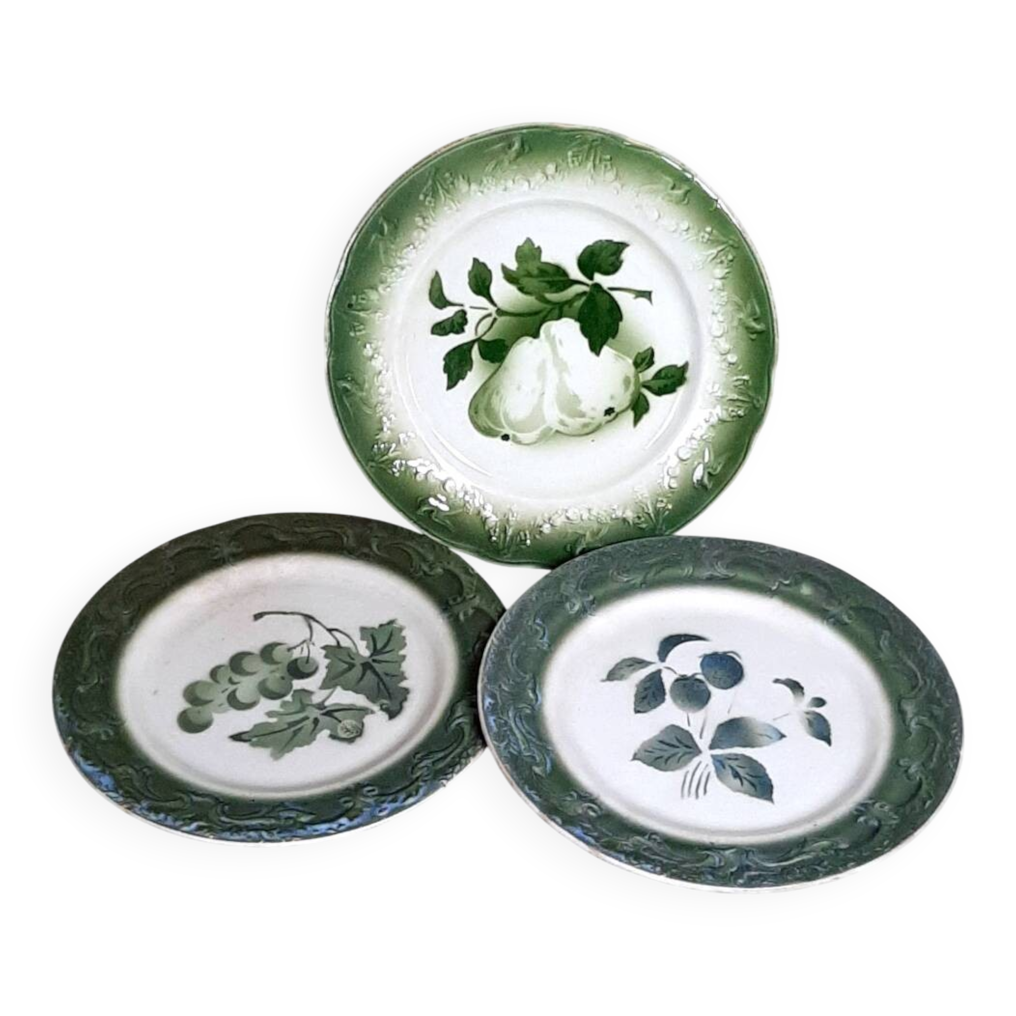 Antique earthenware plates with fruit decoration.