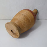Old bottle dressed in vintage wood rattan