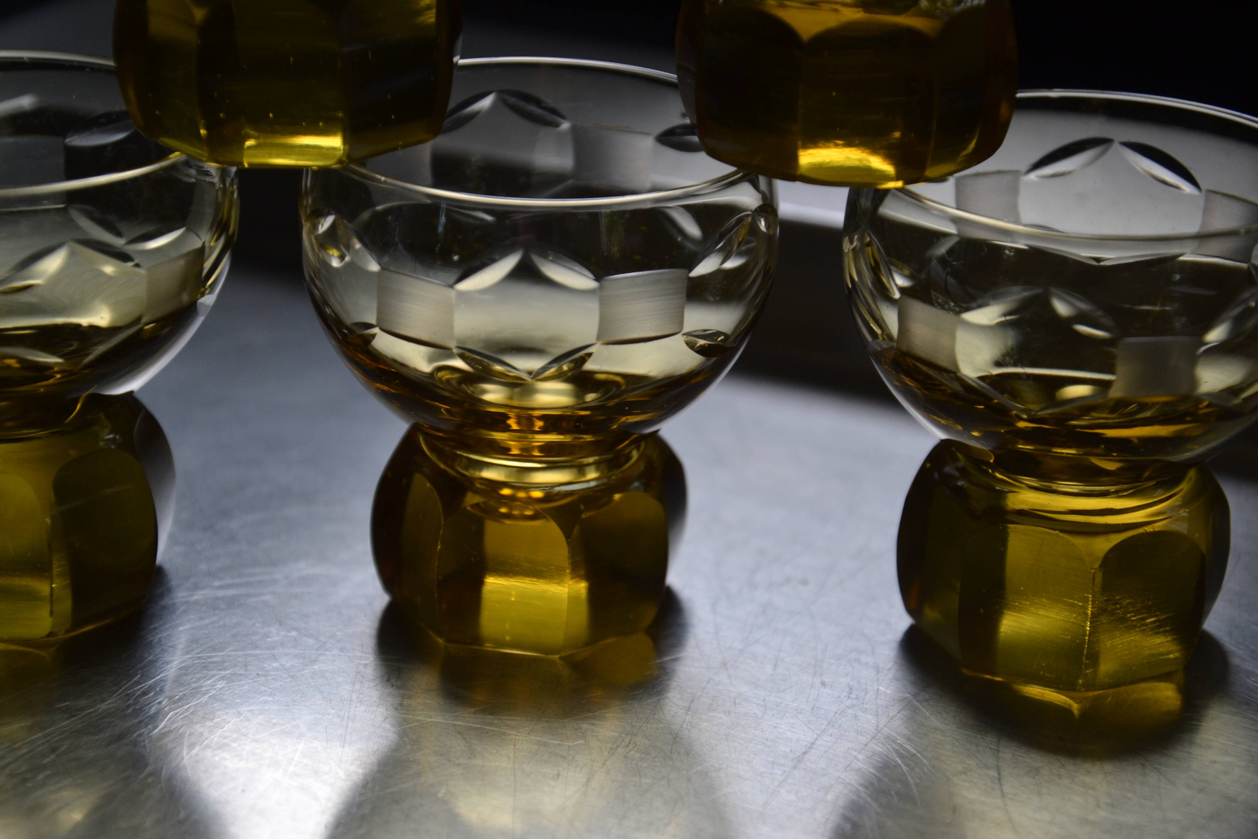 9 small amber art deco glasses