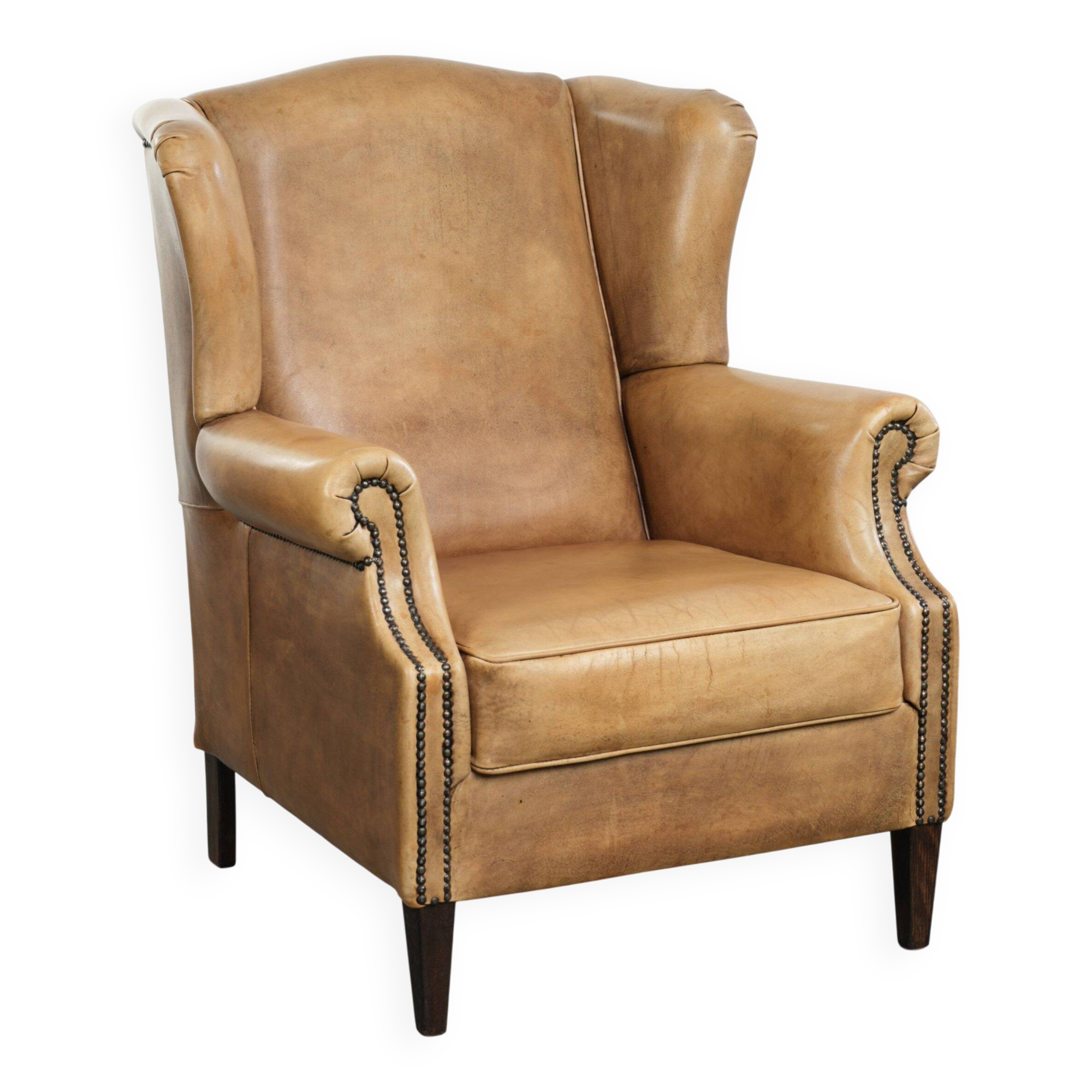Comfortable cowhide wingback armchair with a timeless English look