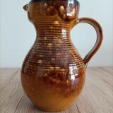 Orange glazed ceramic pitcher