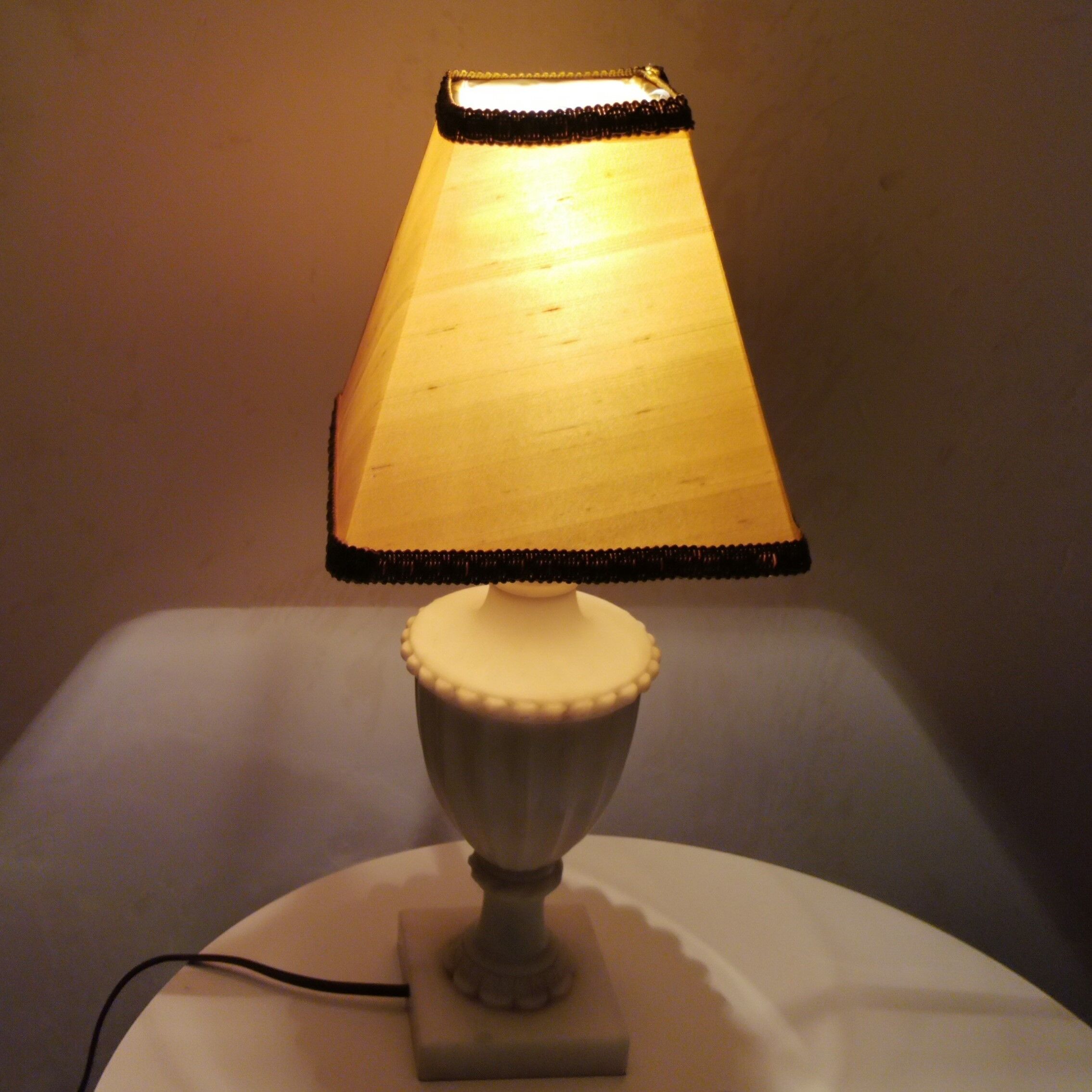 White marble amphora shaped table lamp