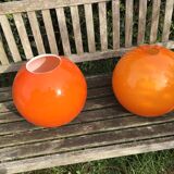 Two orange opaline globes, 30 cm diameter