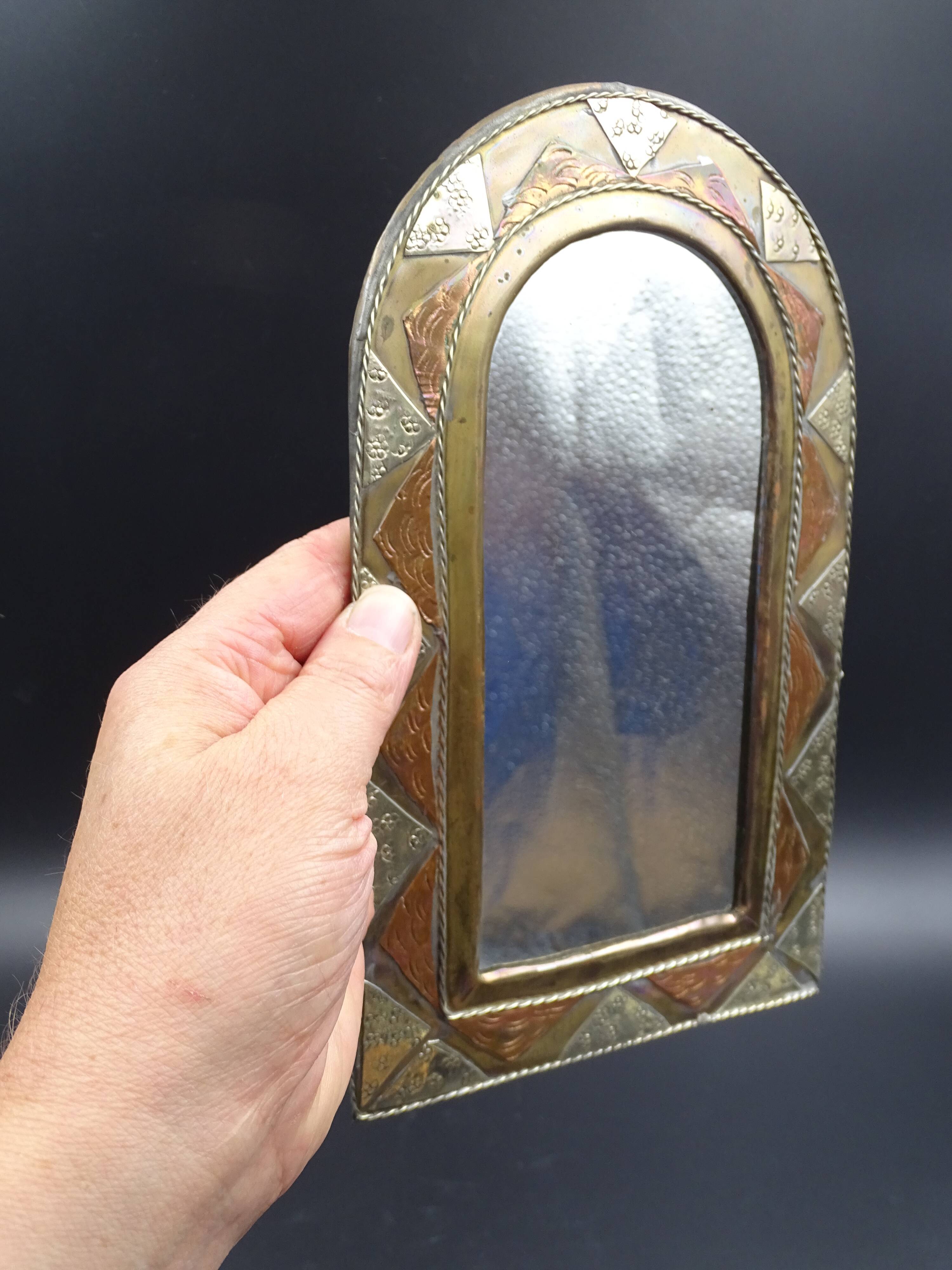 Oriental mirror in worked copper 24x15cm