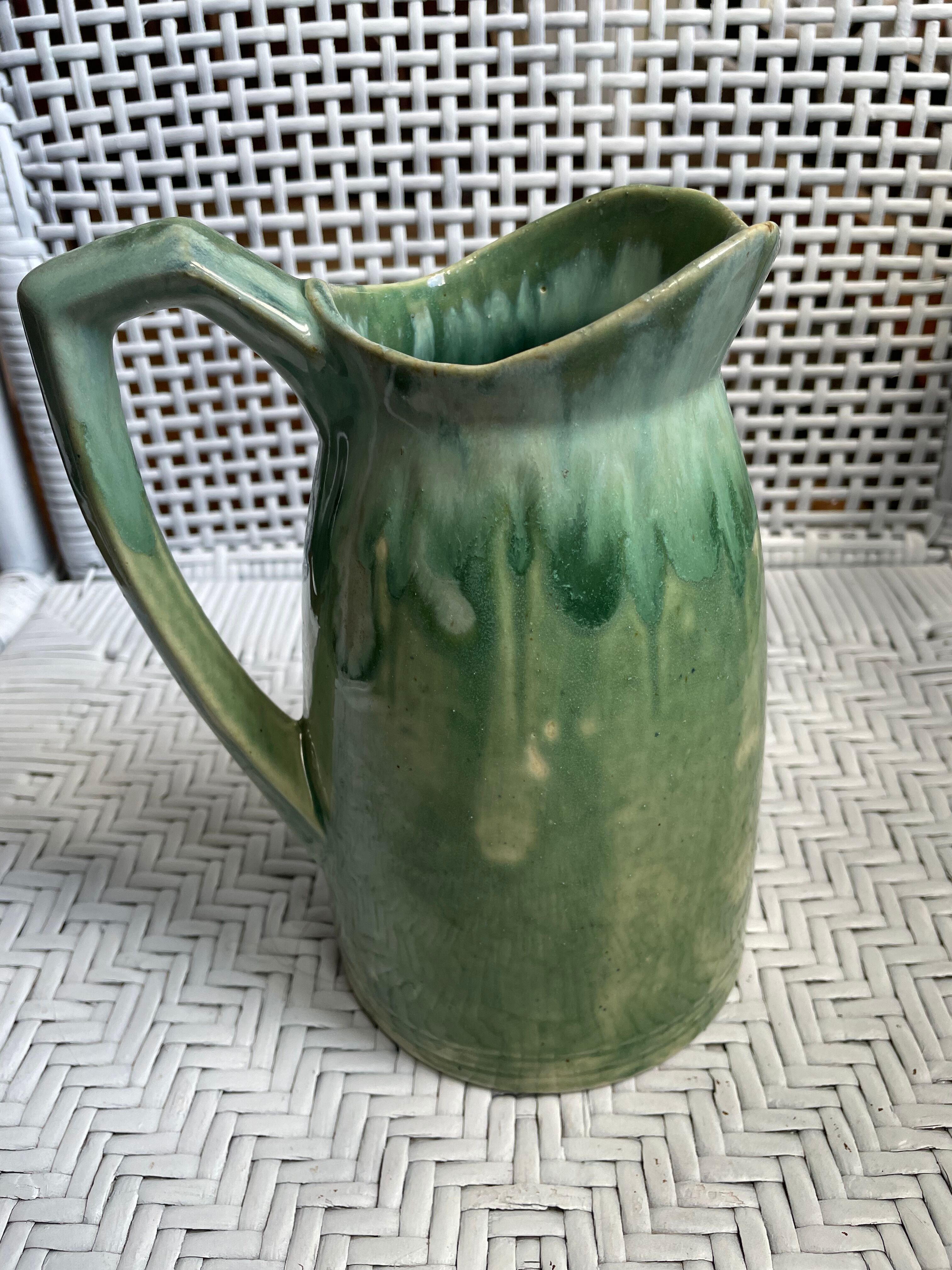Turquoise green enamelled ceramic pitcher
