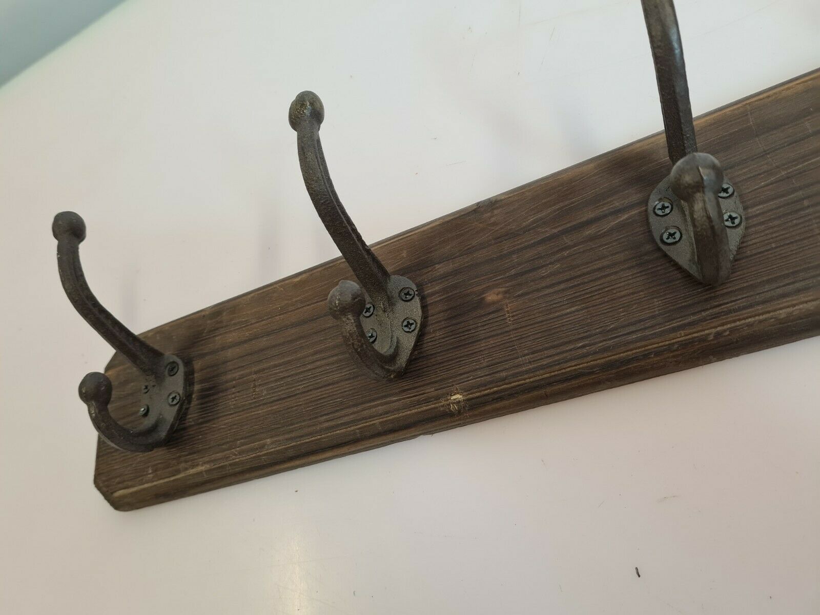 Wooden coat rack and cast iron hooks