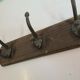 Wooden coat rack and cast iron hooks