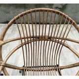 Pair of rattan shell chairs with metallic feet