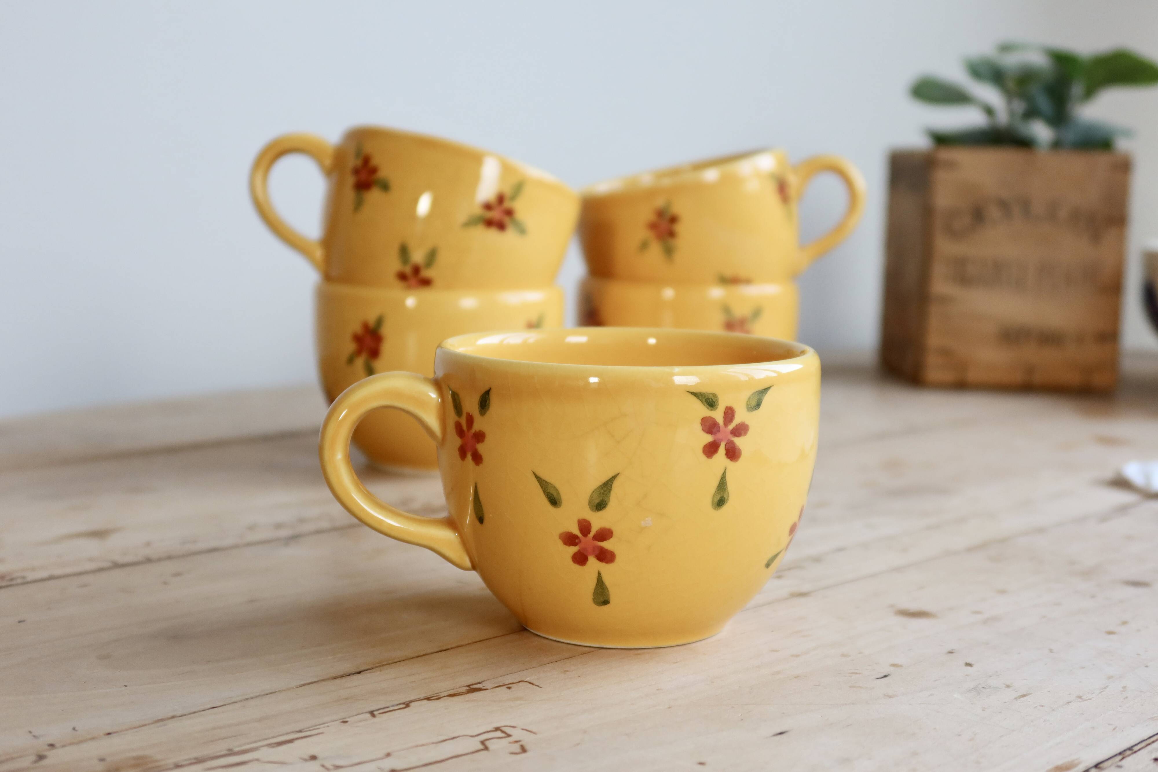 Large vintage ceramic mug in yellow with hand-painted flowers.