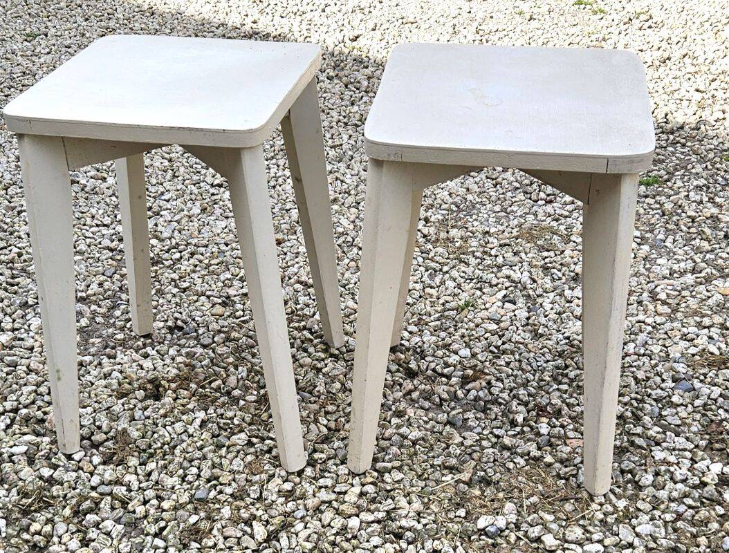 2 white painted wooden stools with compass legs