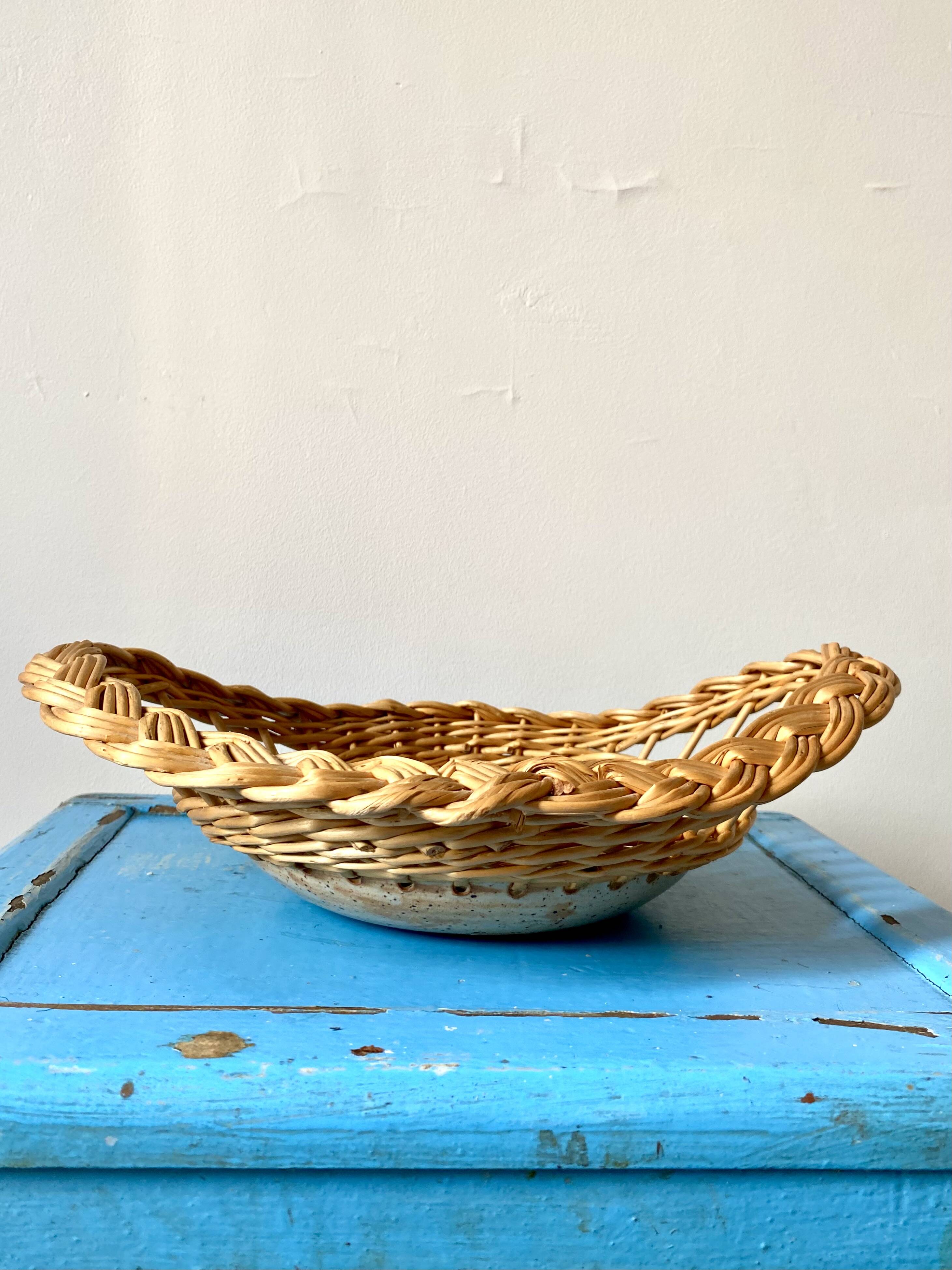 Wicker and ceramic piece signed, 1990s.