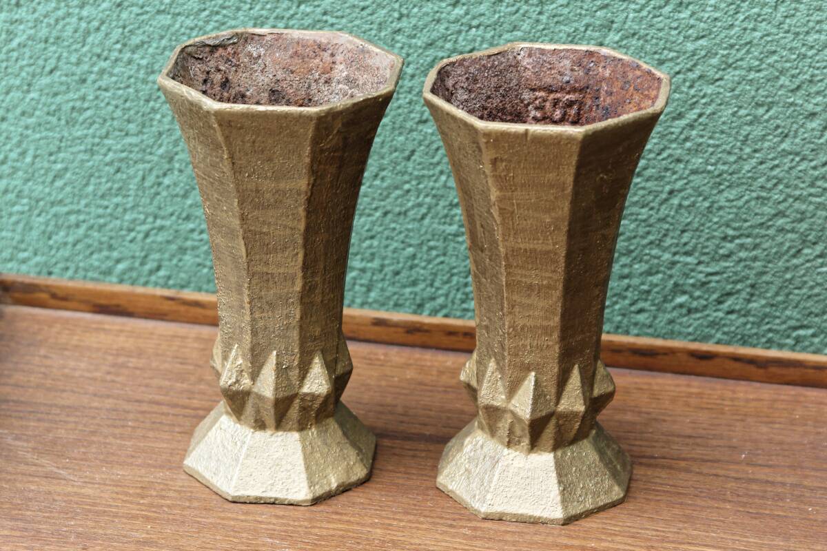 Pair of cast iron cone vases, art deco