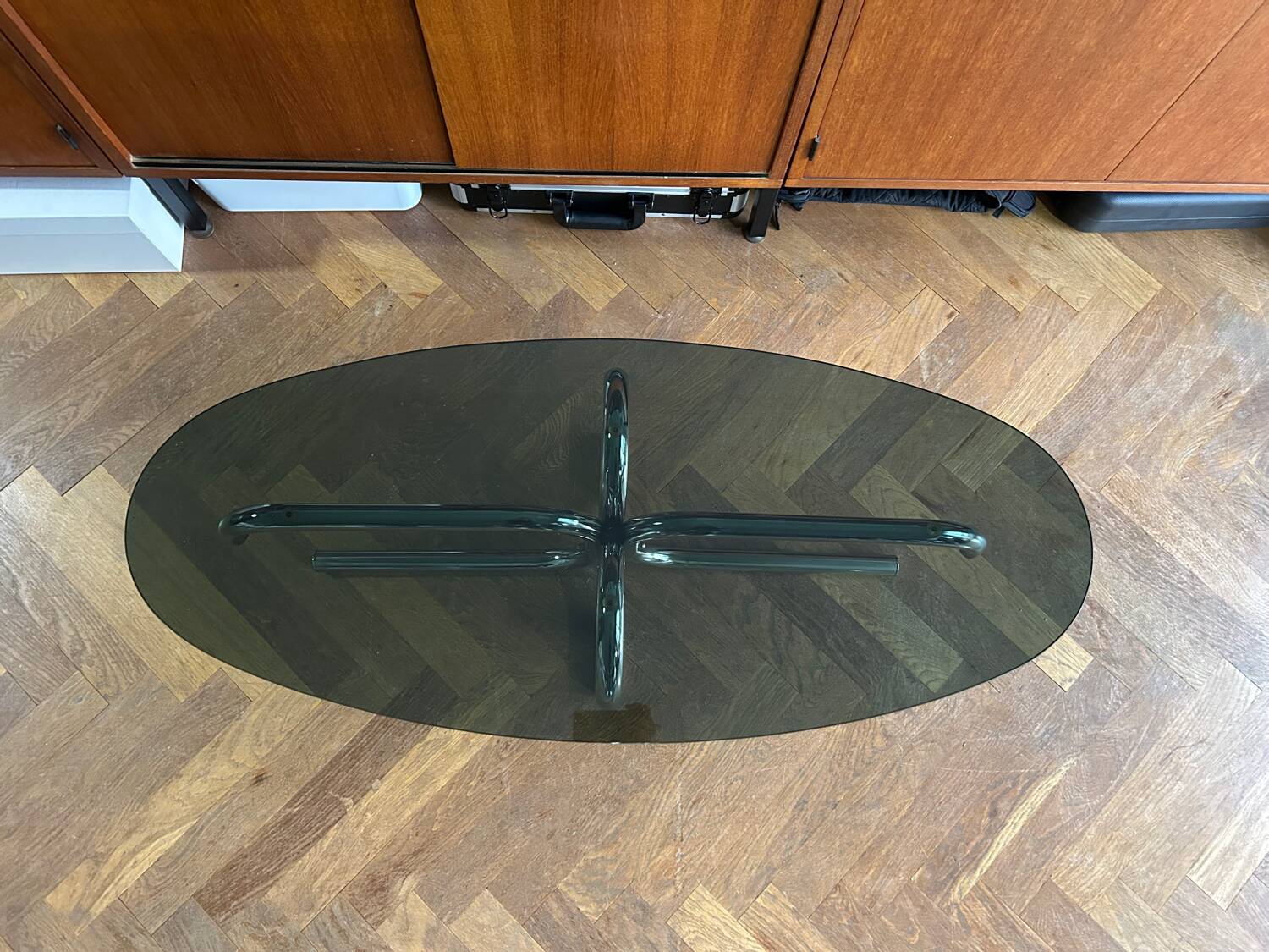 70s design oval coffee table in smoked black glass with chrome legs.