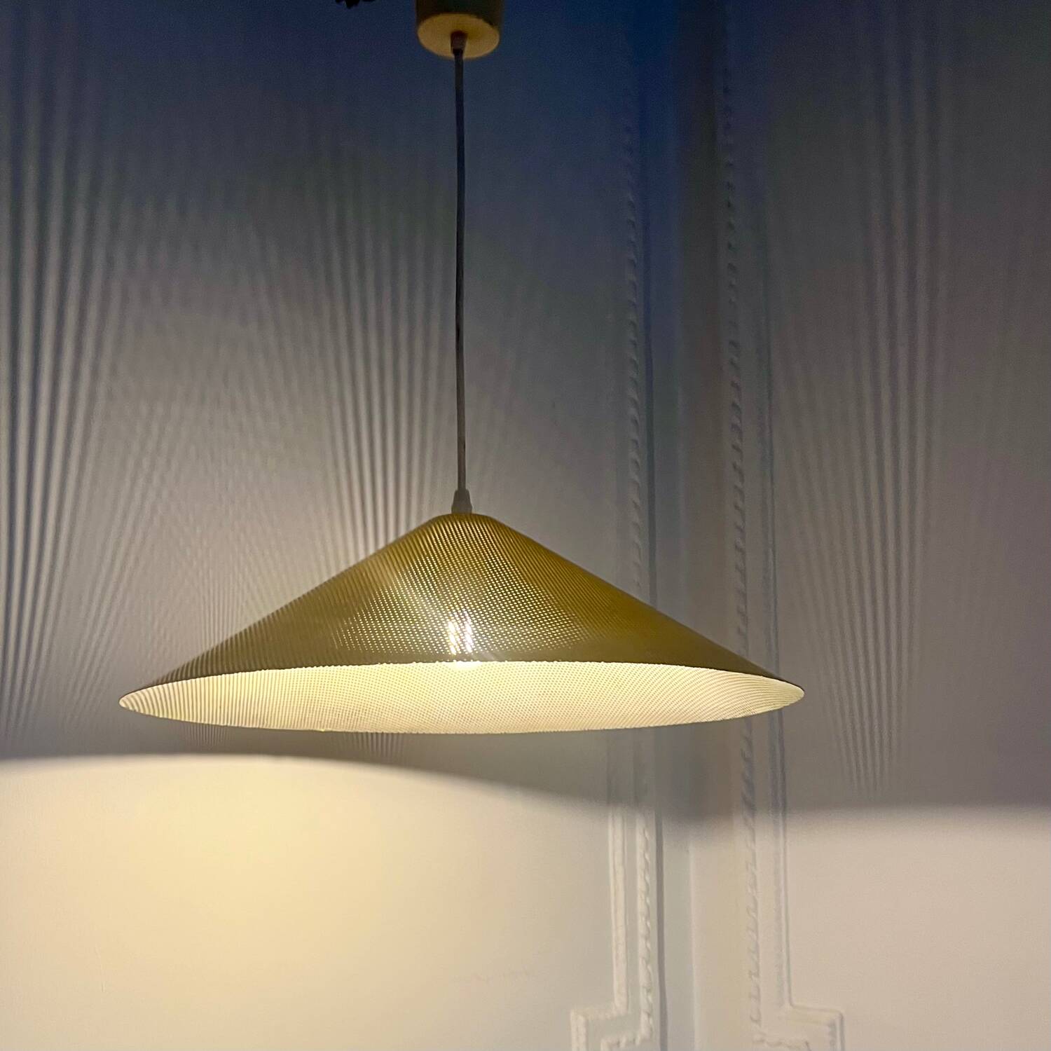 Yellow perforated sheet metal suspension