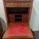 Secretary with a drop-leaf in Louis XVI style made of mahogany and royal red marble.
