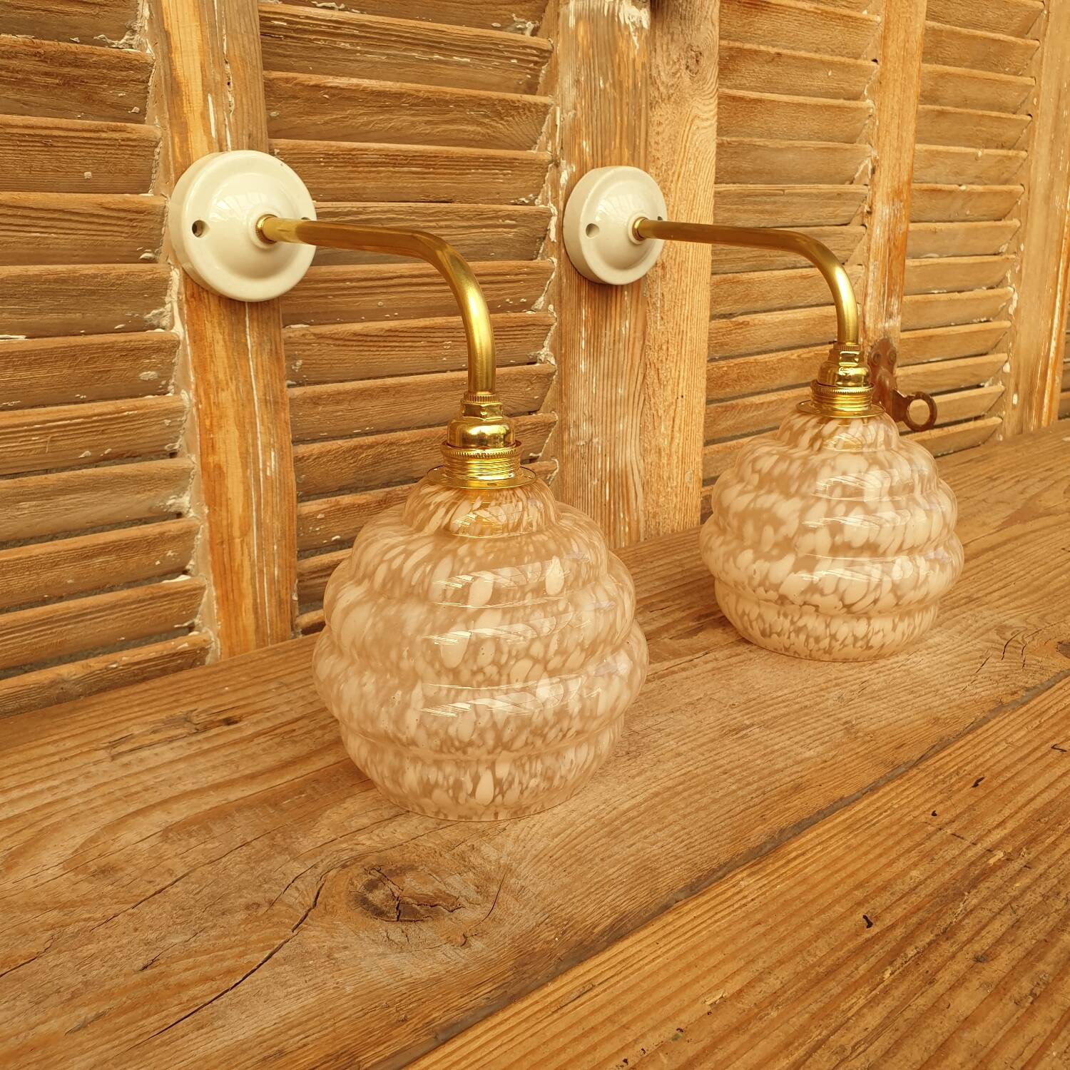 Swan neck wall lights in brass and Clichy glass