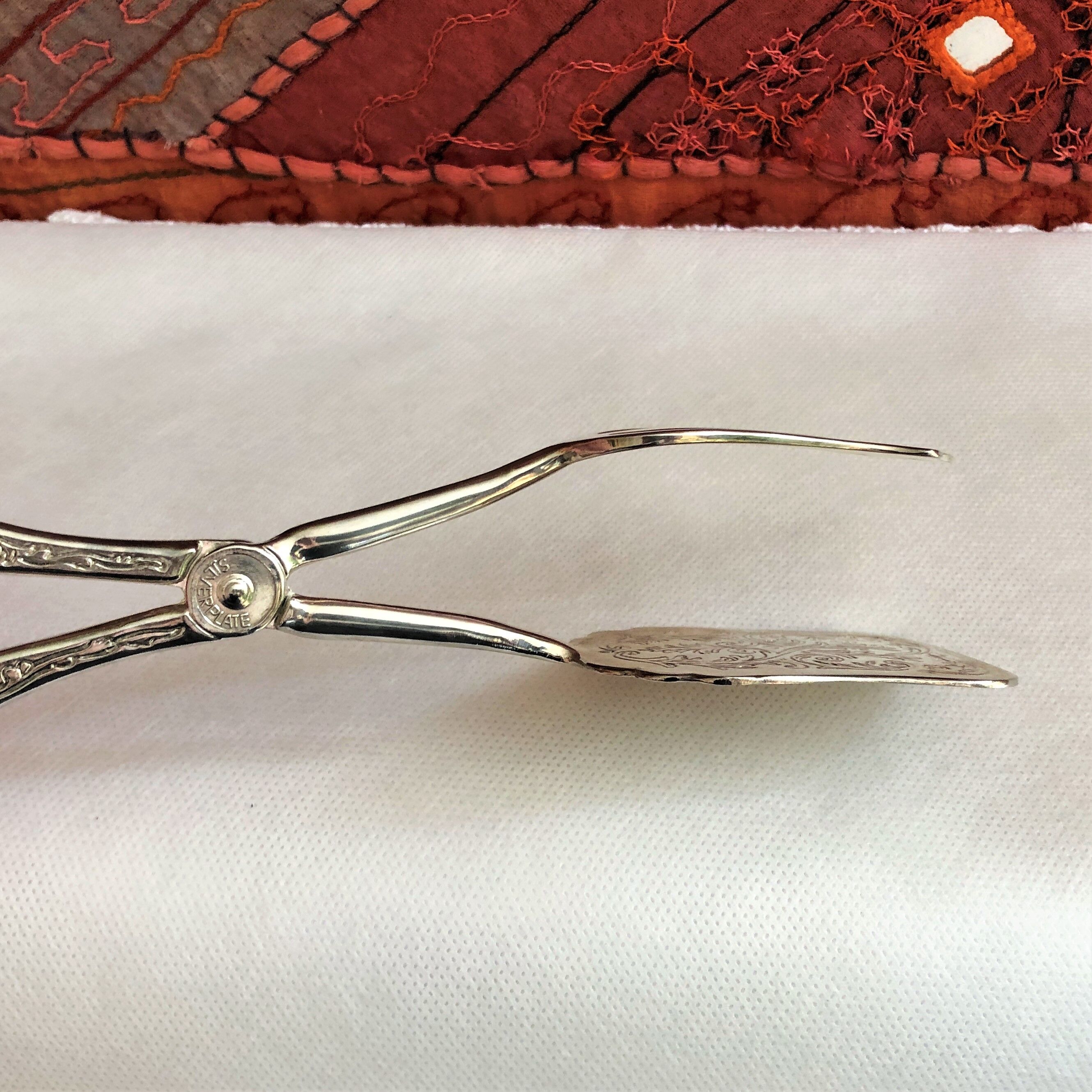 Wrought silver plated cake clips