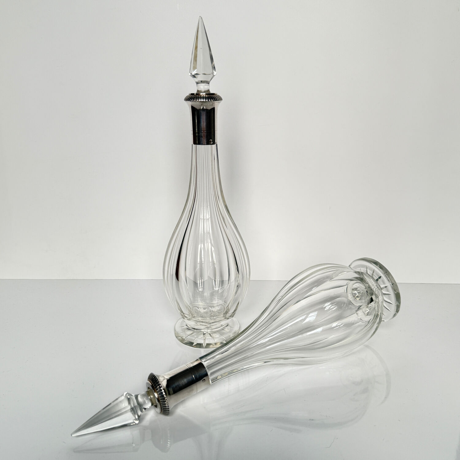 Pair of crystal decanters with solid silver mounts