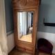 Antique Parisian wardrobe in solid wood – bevelled mirror